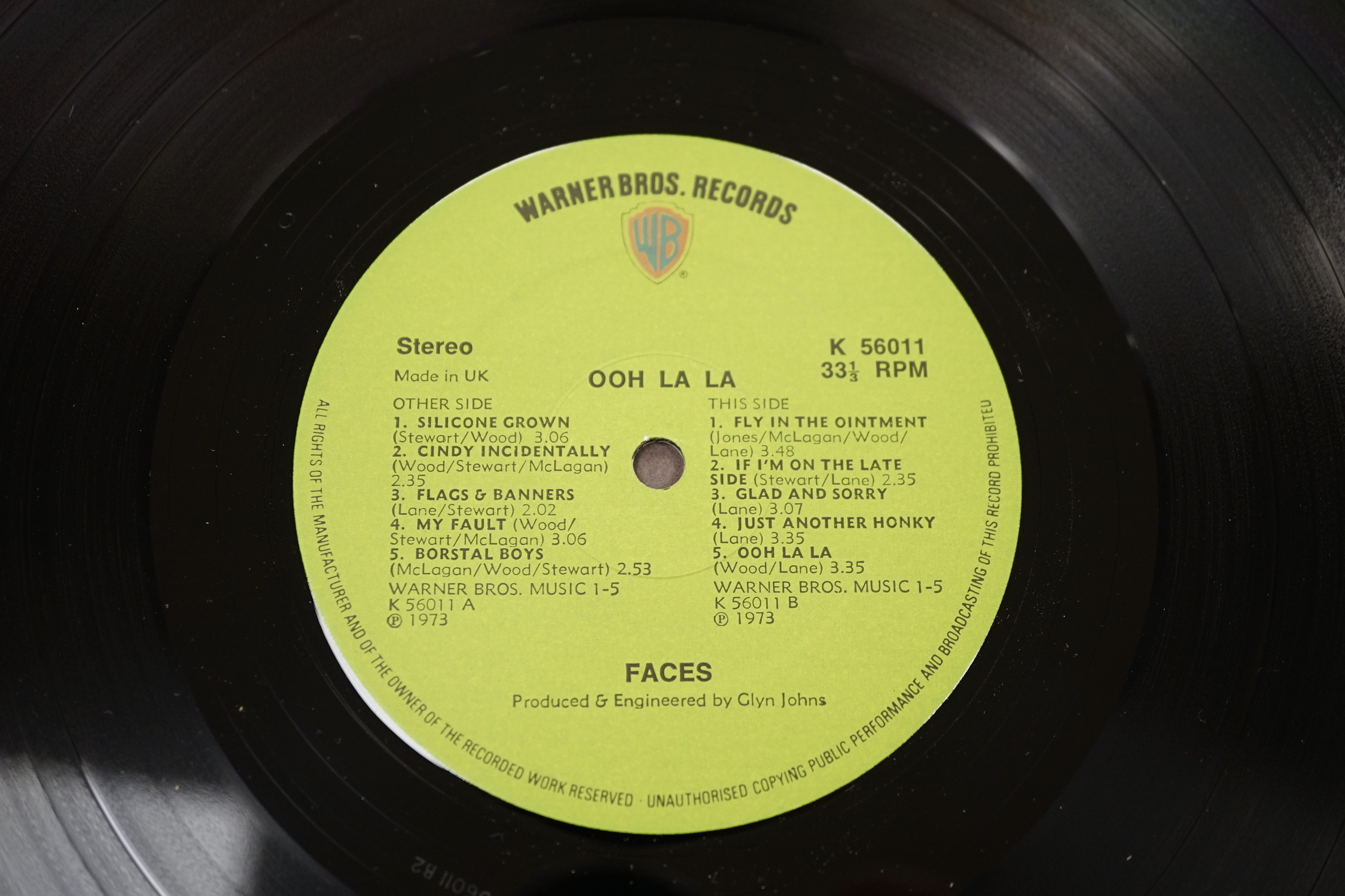 A Faces record LP album; Ooh La La, on green Warner Bros label, K 56011, with ‘Can Can’ picture to reverse label, with original lyric poster, and in die-cut fold-out sleeve